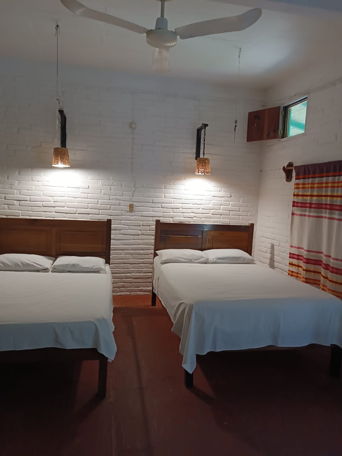 Spacious room with two beds at Hotel La Buena Vista